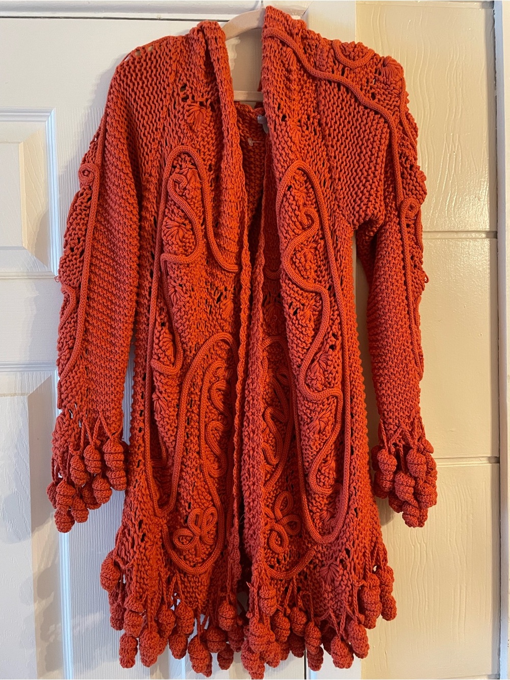 Vintage inspired orange cardigan with pompoms